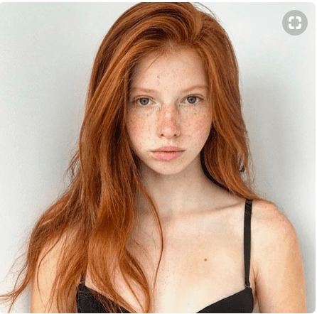 Young girl with natural red hair.