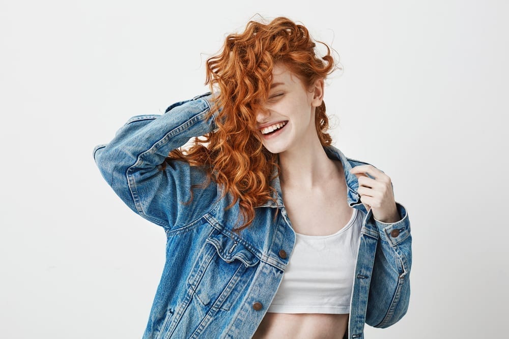 Girl with red curly hair.